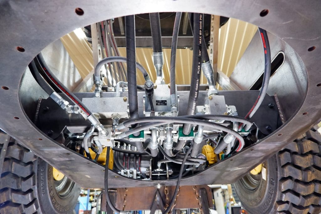 Bottom up vies of hydraulic hoses and equipment carriage.
